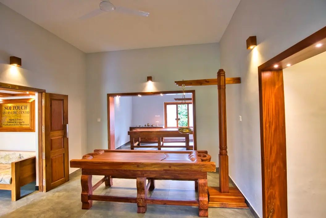 Narrow plunge pool among dense tropical plants at an Ayurveda retreat in Kerala